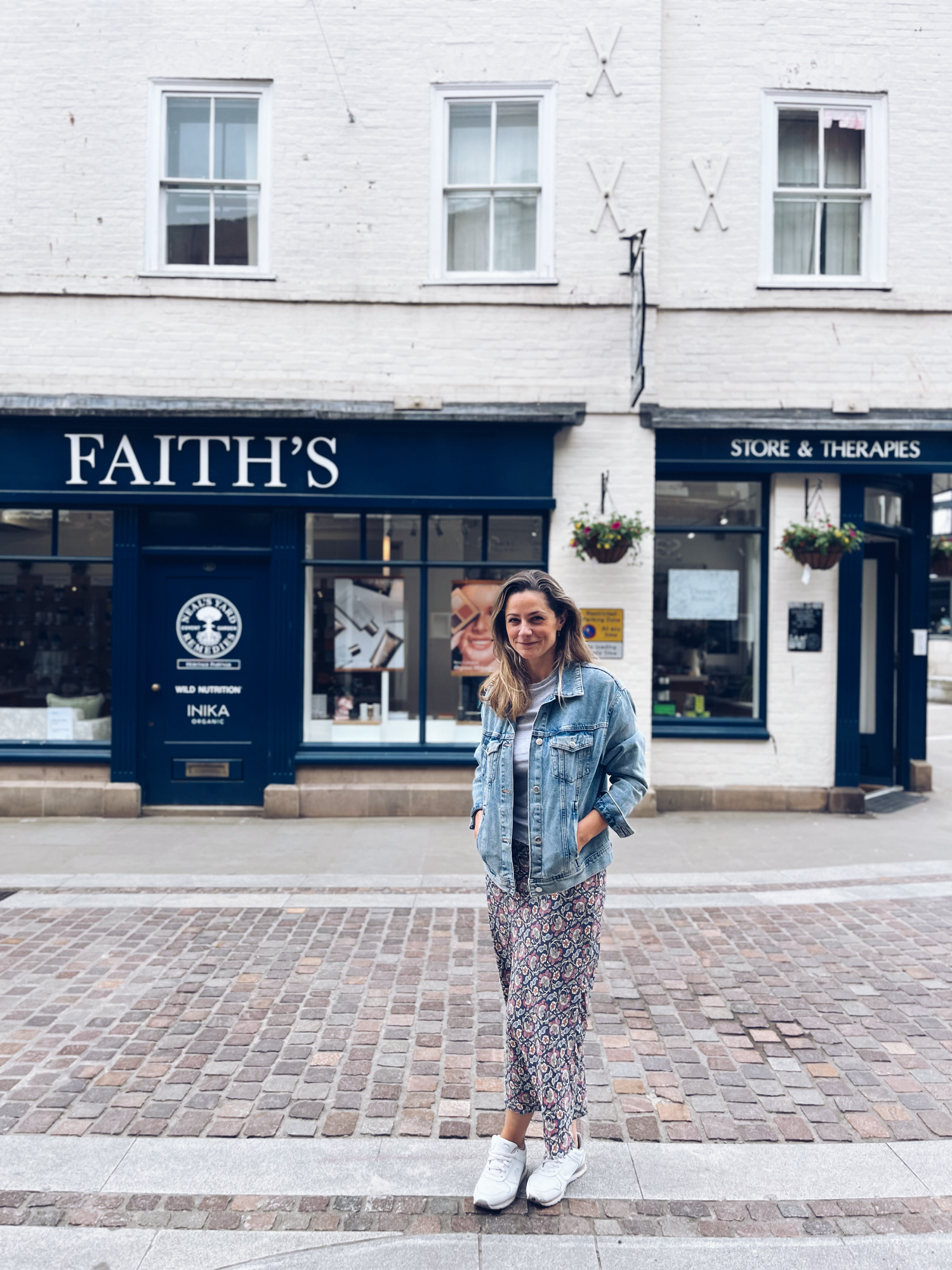 Faith standing outside the shop in hereford